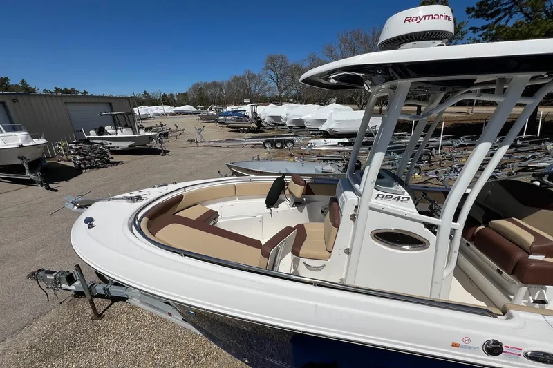 Slide: The Image of 2018 ROBALLO R242 boat with Raymarine equipment in a storage yard. - 2