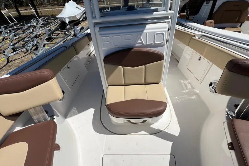Slide: The Image of 2018 ROBALLO R242 boat interior with beige and brown seating. - 22
