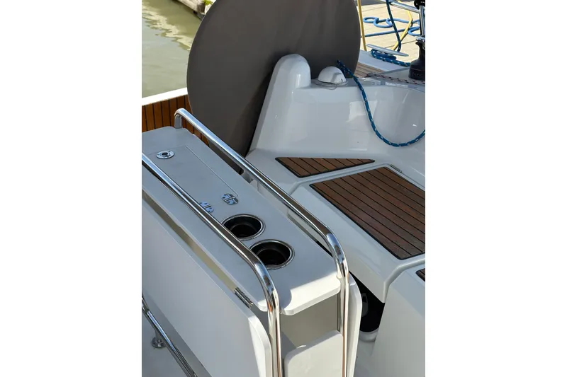Slide: The Image of Cockpit view of 2017 Jeanneau Sun Odyssey 349 sailboat with teak flooring and stainless steel railings. - 10