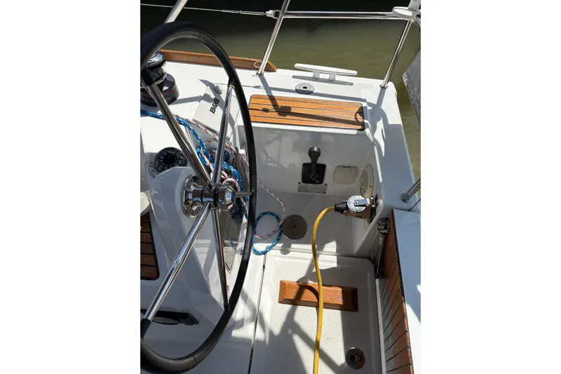 Slide: The Image of Cockpit of 2017 Jeanneau Sun Odyssey 349 sailboat with steering wheel and controls. - 17