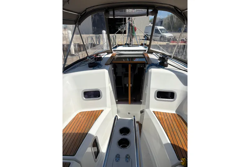 Slide: The Image of Cockpit view of 2017 Jeanneau Sun Odyssey 349 sailboat with teak seating and modern design. - 19