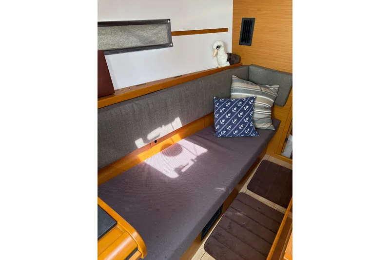 Slide: The Image of Interior of 2017 Jeanneau Sun Odyssey 349 with cozy seating and decorative pillows. - 27