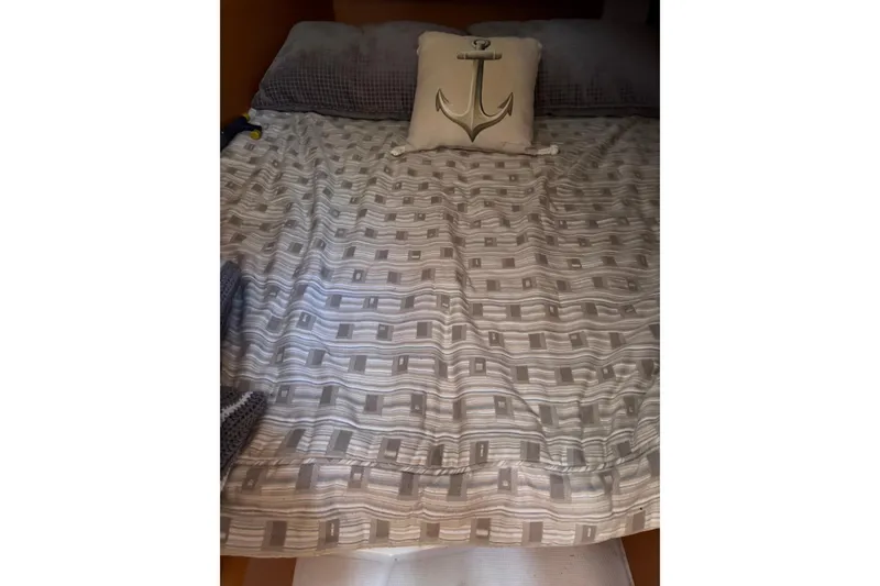 Slide: The Image of Cozy cabin bed with anchor-themed pillow on Jeanneau Sun Odyssey 349, 2017 model. - 28