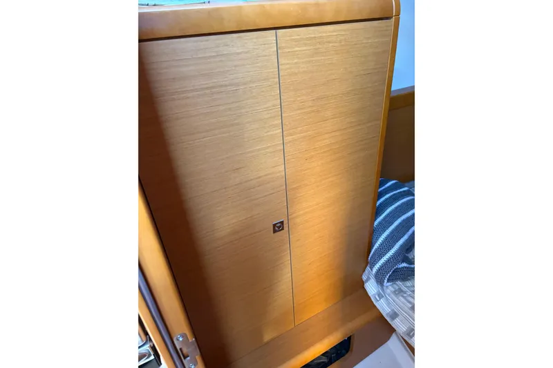 Slide: The Image of Wooden cabinet inside 2017 Jeanneau Sun Odyssey 349 sailboat interior. - 29
