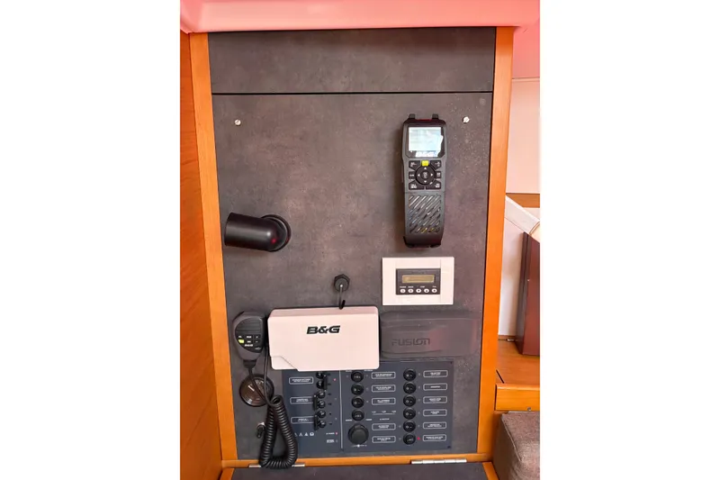 Slide: The Image of Control panel of 2017 Jeanneau Sun Odyssey 349 sailboat with navigation and communication equipment. - 34