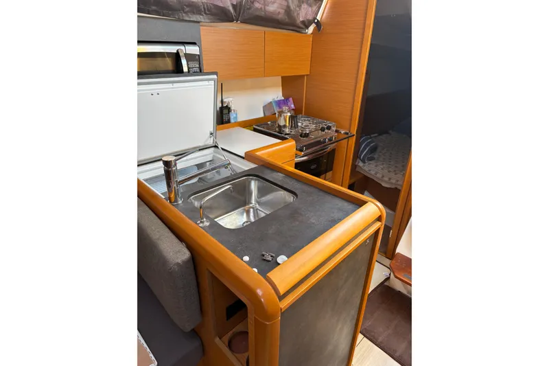 Slide: The Image of Interior of 2017 Jeanneau Sun Odyssey 349 yacht kitchen with sink and stove. - 35