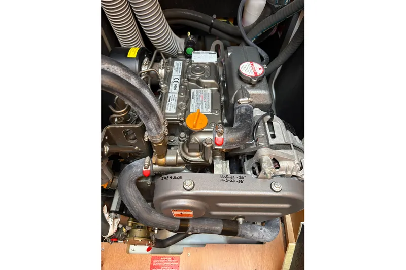 Slide: The Image of Engine of a 2017 Jeanneau Sun Odyssey 349 sailboat, showcasing detailed components. - 42