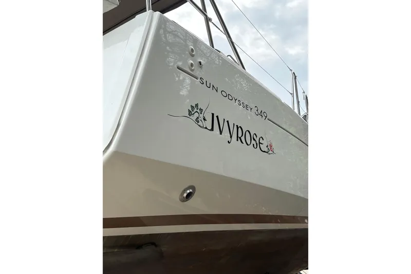 Slide: The Image of 2017 Jeanneau Sun Odyssey 349 sailboat named Ivyrose, featuring sleek design and elegant lettering. - 7
