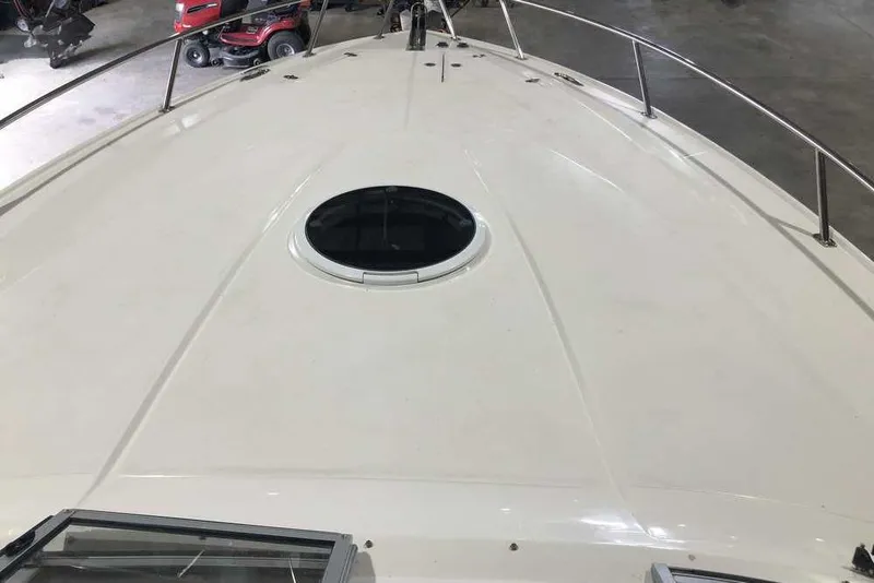 Slide: The Image of 2007 Regal 3350 Sport Cruiser deck with hatch, in a garage setting. - 10