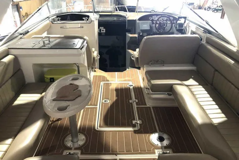 Slide: The Image of 2007 Regal 3350 Sport Cruiser interior with seating, table, and helm. - 11