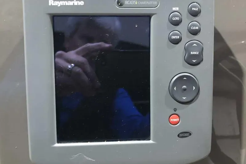 Slide: The Image of Raymarine RC435i chartplotter on 2007 Regal 3350 Sport Cruiser dashboard. - 15