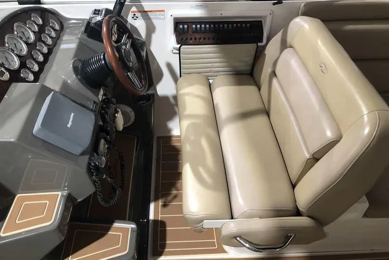 Slide: The Image of 2007 Regal 3350 Sport Cruiser helm with beige seating and instrument panel. - 16