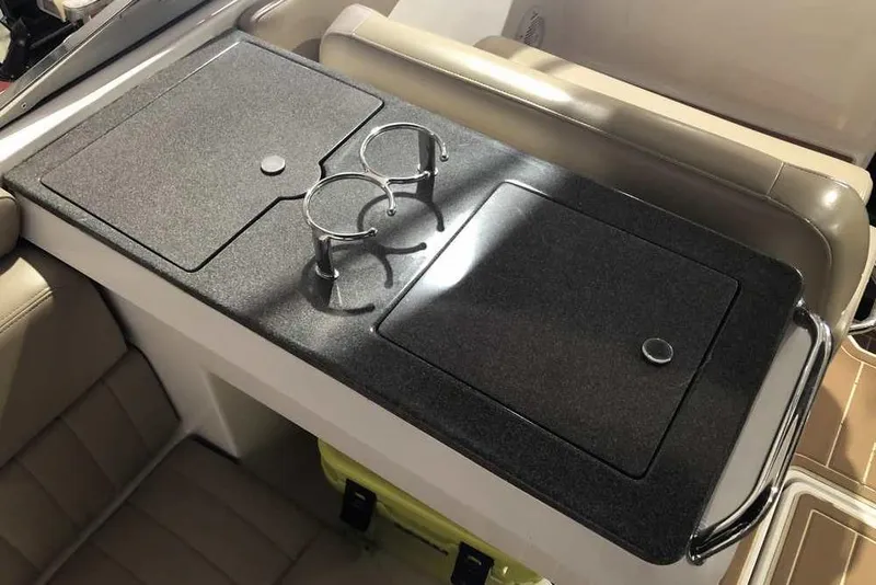 Slide: The Image of 2007 Regal 3350 Sport Cruiser interior with cup holders and storage compartments. - 21