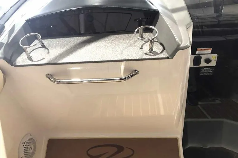 Slide: The Image of 2007 Regal 3350 Sport Cruiser interior with cup holders and control panel. - 24