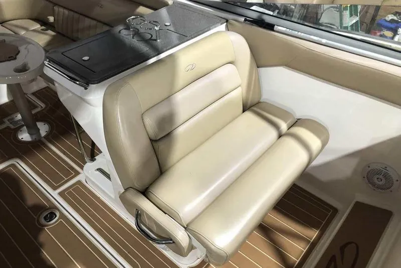 Slide: The Image of Luxurious interior of 2007 Regal 3350 Sport Cruiser with beige seating and wood flooring. - 25