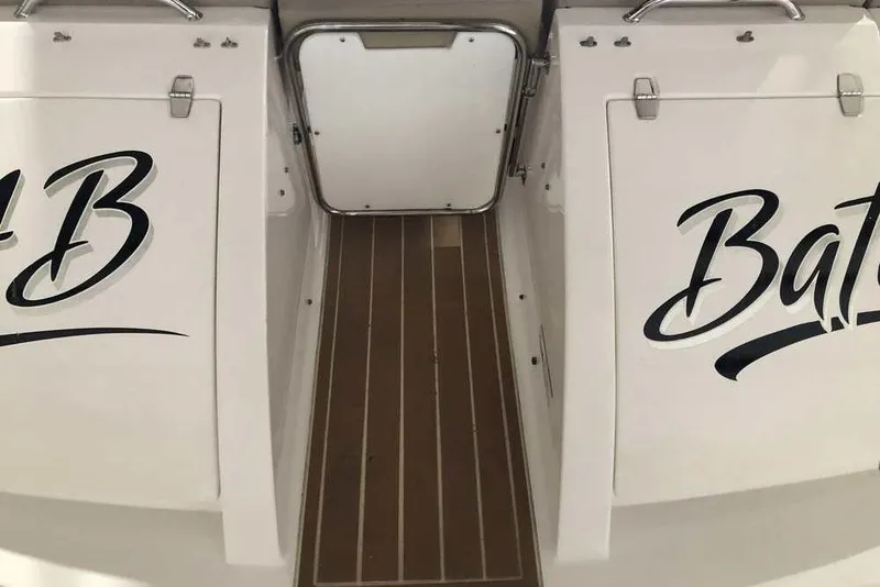 Slide: The Image of 2007 Regal 3350 Sport Cruiser boat deck with stylish lettering and wooden flooring. - 30