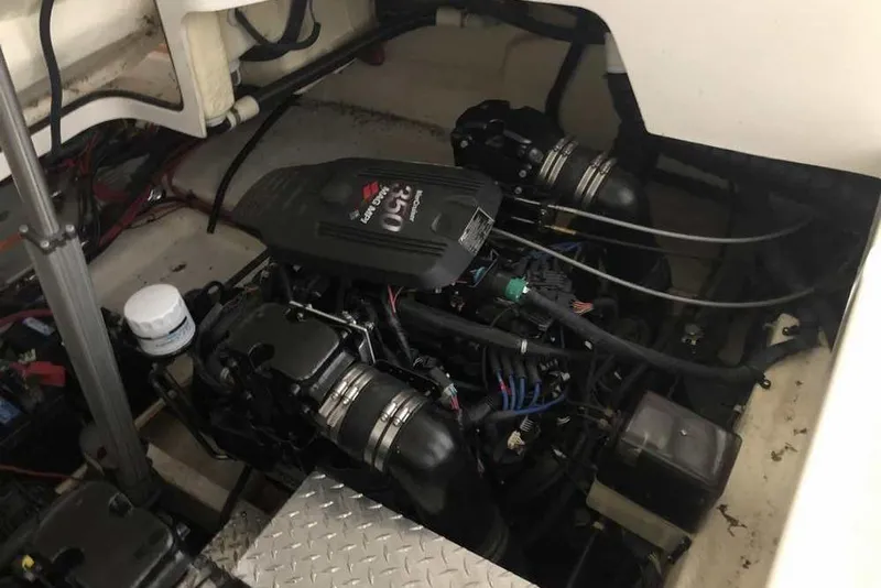 Slide: The Image of Engine compartment of a 2007 Regal 3350 Sport Cruiser, showcasing dual engines and components. - 45