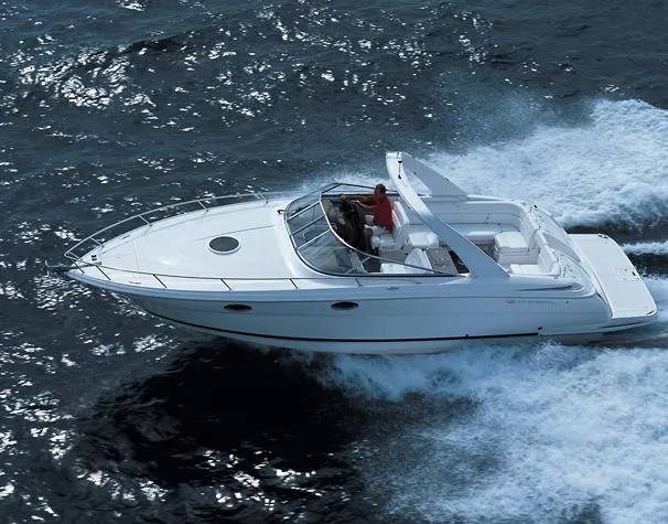 Slide: The Image of Manufacturer / Sistership Image Freshwater 2007 Regal 3350 Sport Cruiser docked at a marina, featuring sleek black and white design. - 46