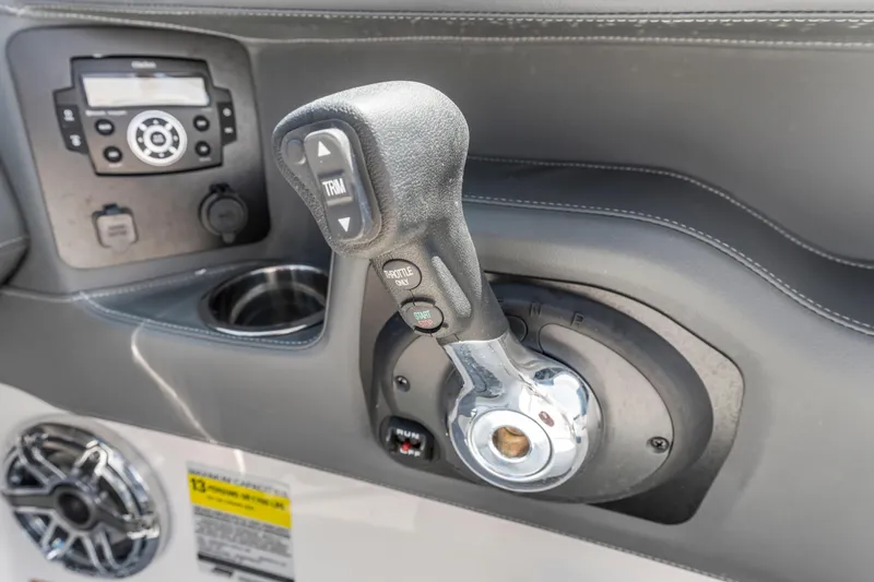 Slide: The Image of Control panel of 2022 Chaparral 247 SSX boat with throttle and audio system. - 10