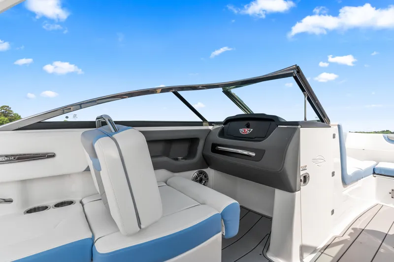 Slide: The Image of 2022 Chaparral 247 SSX boat interior with sleek seating and modern dashboard design. - 15