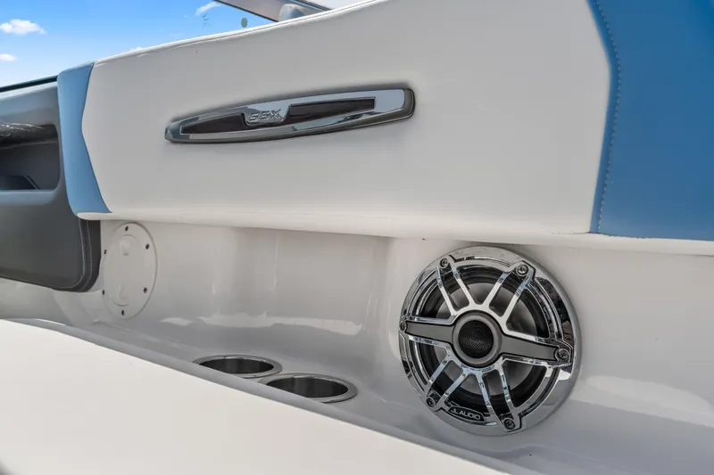 Slide: The Image of 2022 Chaparral 247 SSX boat interior with JL Audio speaker and cup holders. - 18
