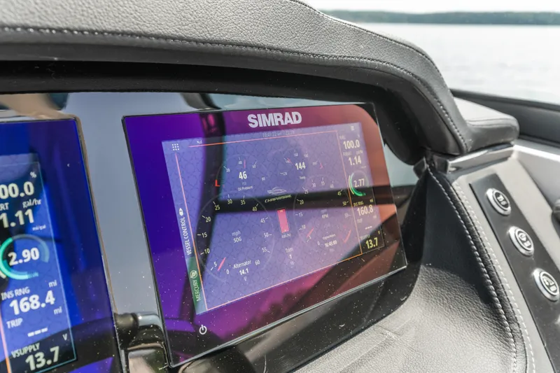 Slide: The Image of Simrad display on 2022 Chaparral 247 SSX boat dashboard, showing navigation data. - 6