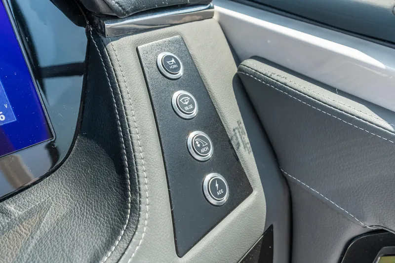Slide: The Image of Control panel of 2022 Chaparral 247 SSX boat with labeled buttons. - 8