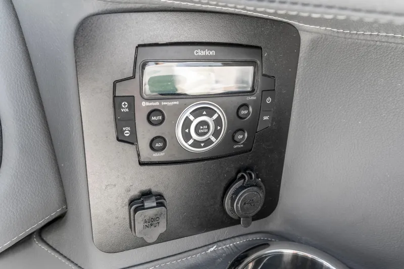 Slide: The Image of Clarion audio system in 2022 Chaparral 247 SSX boat dashboard. - 9