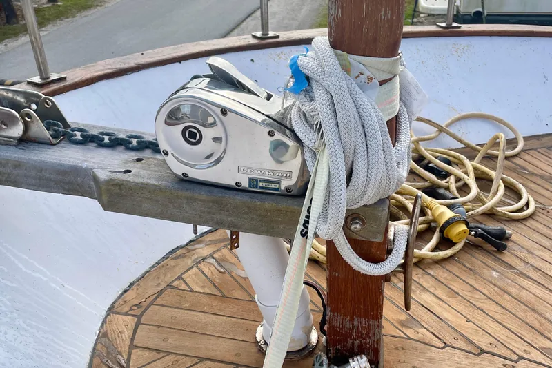 Slide: The Image of Deck equipment on 1981 Albin 36 Trawler, featuring winch, ropes, and wooden flooring. - 14