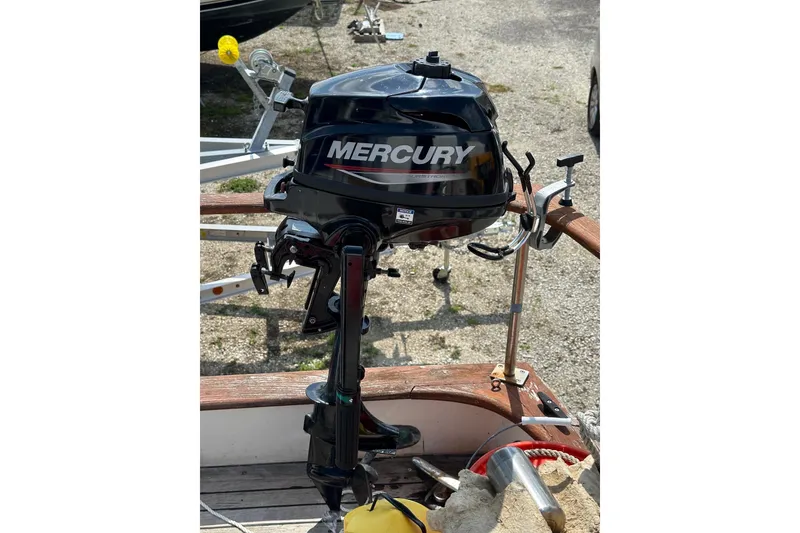 Slide: The Image of Mercury outboard motor mounted on 1981 Albin 36 Trawler, dockside view. - 24