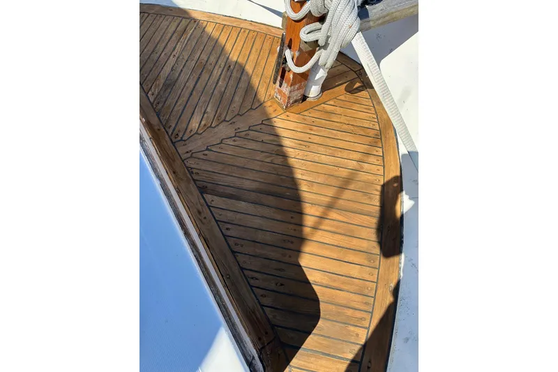 Slide: The Image of Wooden deck of 1981 Albin 36 Trawler with ropes and shadows. - 31