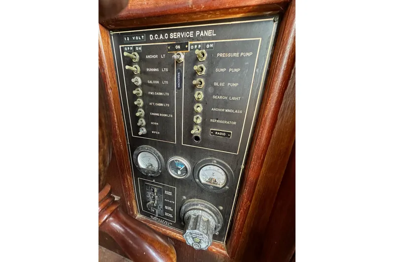 Slide: The Image of Control panel of a 1981 Albin 36 Trawler with switches and gauges. - 38