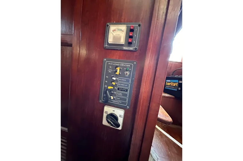 Slide: The Image of Electrical panel on 1981 Albin 36 Trawler, featuring A-C load center and EverStart battery. - 39