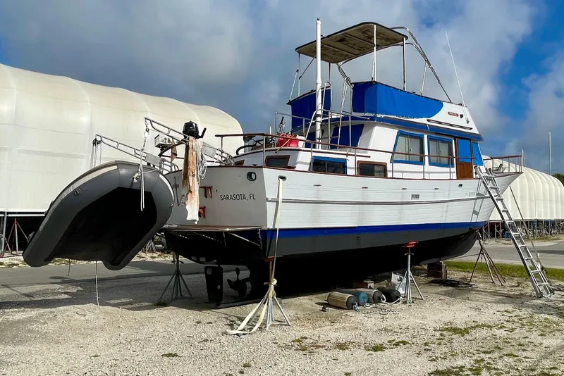 Slide: The Image of 1981 Albin 36 Trawler on dry dock in Sarasota, FL, with inflatable dinghy attached. - 4