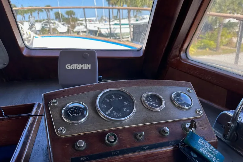 Slide: The Image of 1981 Albin 36 Trawler helm with Garmin device and vintage gauges. - 41
