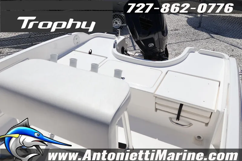Slide: The Image of 2026 Bayliner Trophy T18 boat interior with motor, contact info, and website displayed. - 17