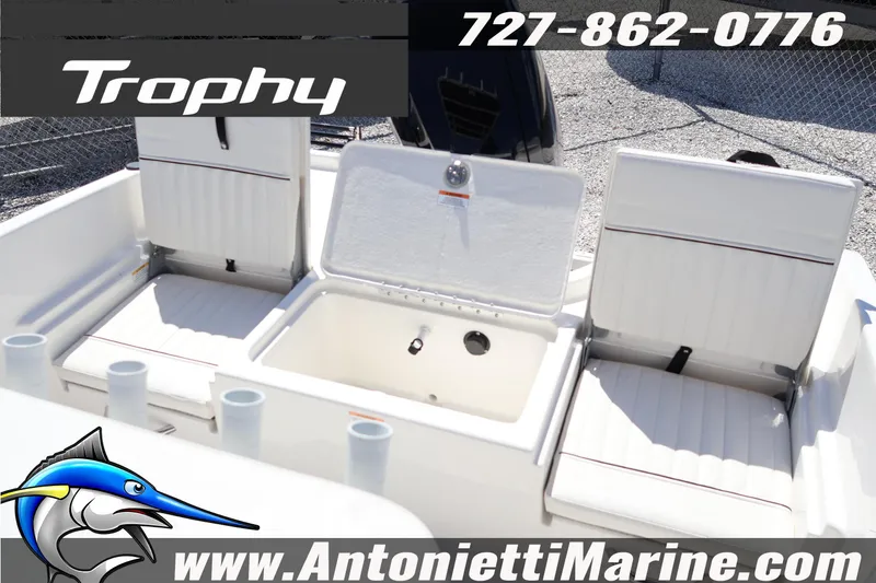 Slide: The Image of 2026 Bayliner Trophy T18 boat interior with seating and storage compartments. - 18