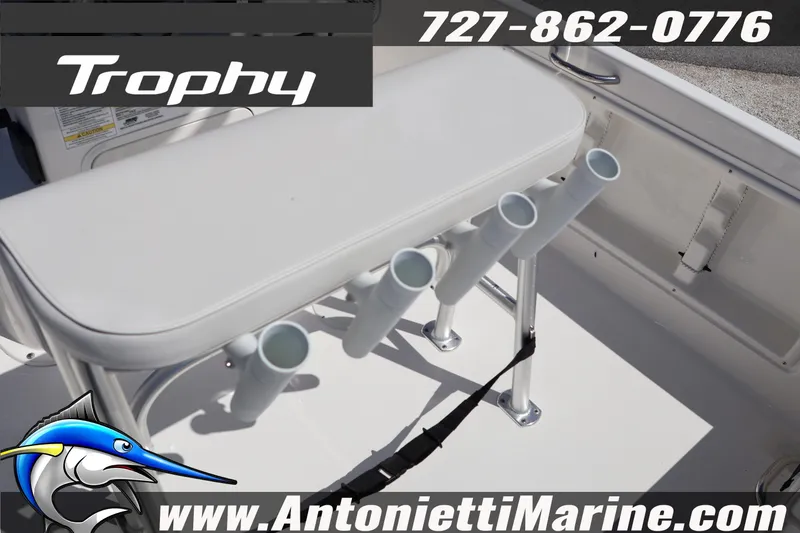 Slide: The Image of 2026 Bayliner Trophy T18 boat interior with rod holders and seating. - 19