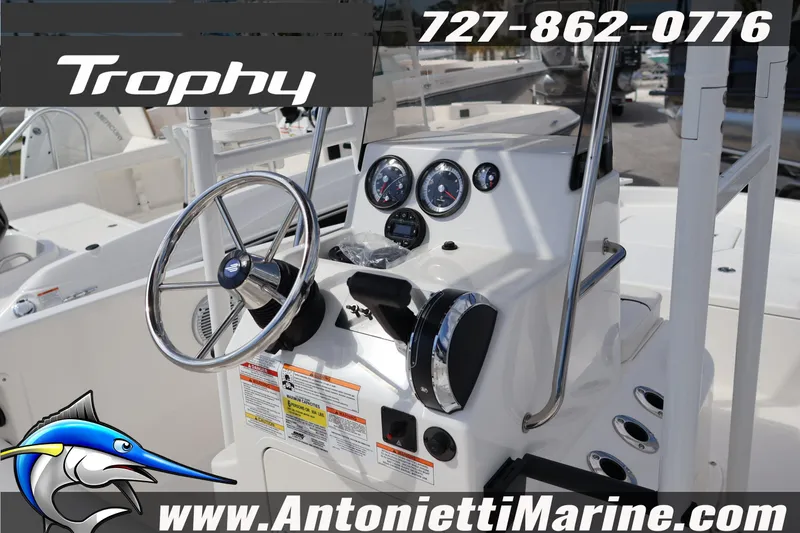 Slide: The Image of 2026 Bayliner Trophy T18 boat dashboard with steering wheel and gauges. - 3