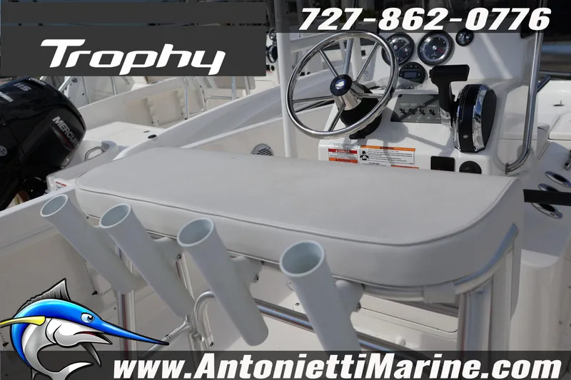 Slide: The Image of 2026 Bayliner Trophy T18 boat interior with steering wheel and rod holders, Antonietti Marine branding. - 4