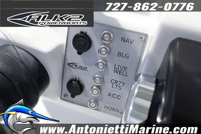Slide: The Image of Control panel of 2026 ALK2 Powerboats 22 CRS with switches and branding. - 12