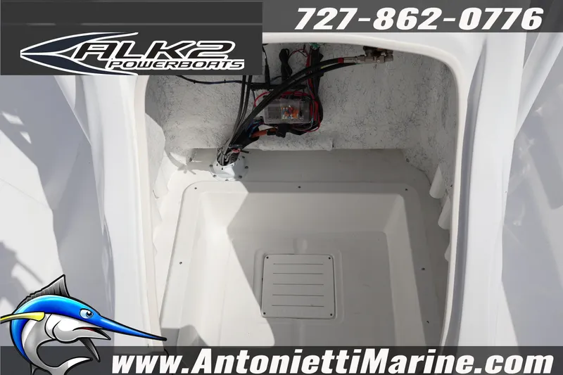 Slide: The Image of Interior view of 2026 ALK2 Powerboats 22 CRS, showcasing wiring and storage space. - 16
