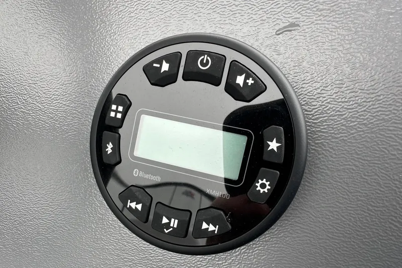 Slide: The Image of Control panel with Bluetooth feature on 2025 Smoker Craft Resorter 151 boat. - 13