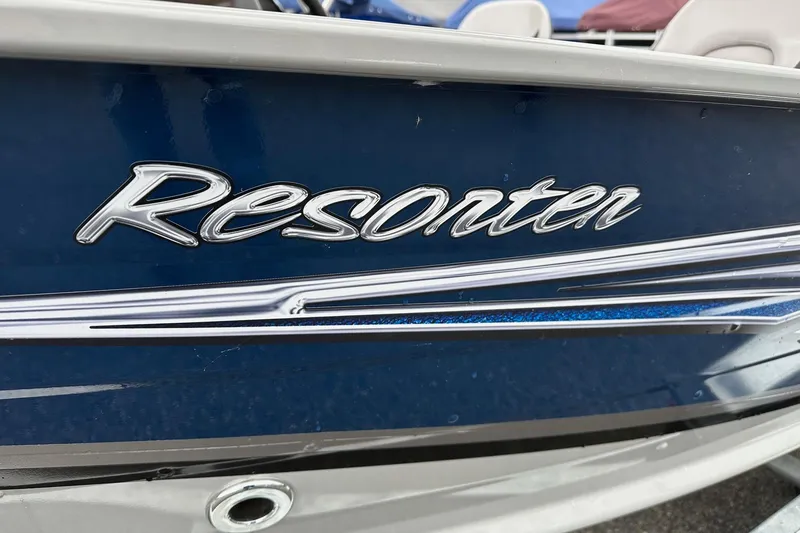Slide: The Image of 2025 Smoker Craft Resorter 151 boat, blue exterior with chrome detailing. - 2