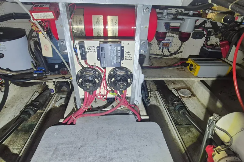 Slide: The Image of Engine room of 1988 Custom Holland Wesmac-Foley Flybridge Cruiser with electrical components and wiring. - 109