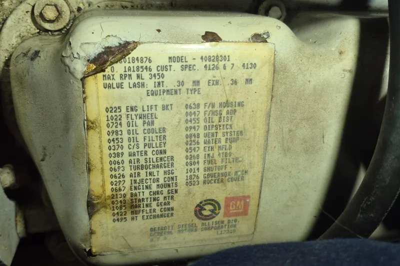 Slide: The Image of Engine component label on a 1988 Holland Wesmac-Foley Flybridge Cruiser. - 112