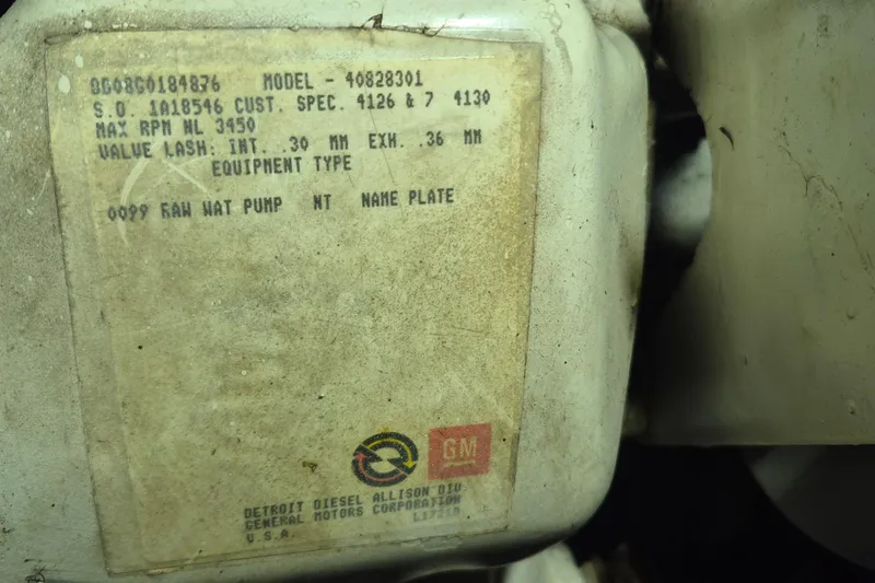 Slide: The Image of Close-up of a Detroit Diesel engine label on a 1988 Holland Wesmac-Foley Flybridge Cruiser. - 113