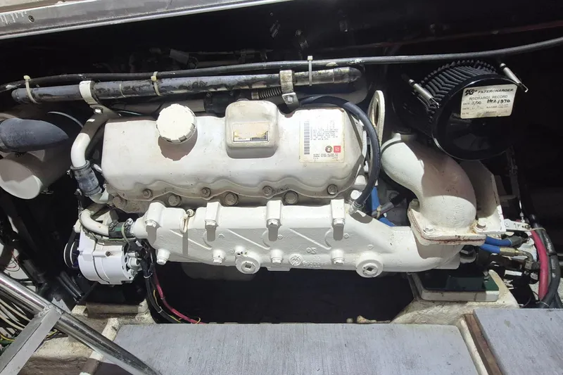 Slide: The Image of Engine compartment of 1988 Custom Holland Wesmac-Foley Flybridge Cruiser, showcasing mechanical components. - 116