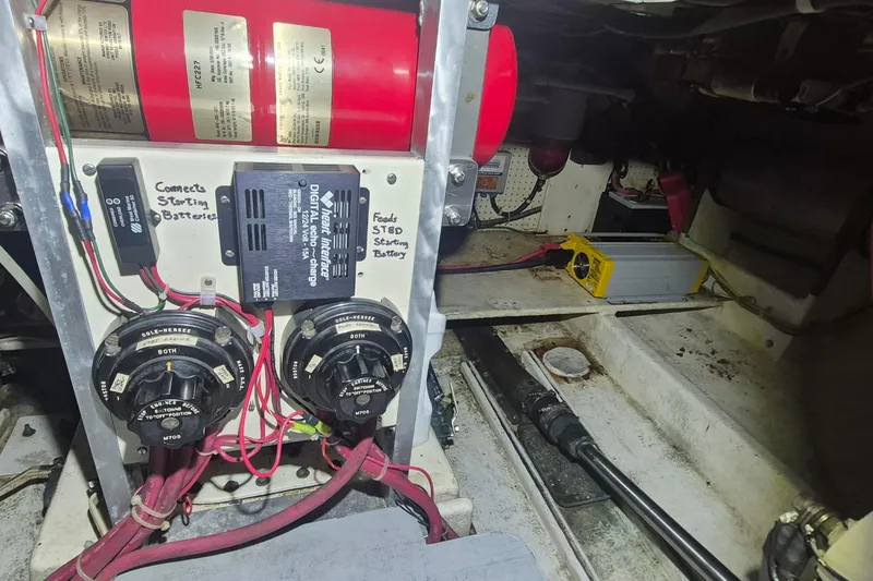 Slide: The Image of Electrical system of 1988 Custom Holland Wesmac-Foley Flybridge Cruiser with battery connections and charger. - 117