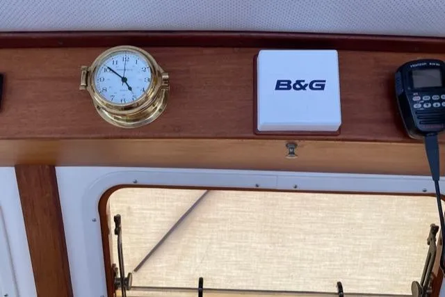 Slide: The Image of Interior of 1988 Holland Wesmac-Foley Flybridge Cruiser with clock and B&G device. - 22